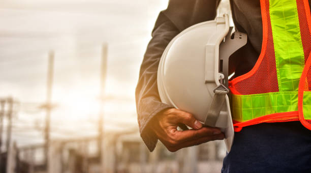 A commercial interior construction site with workers following safety rules.